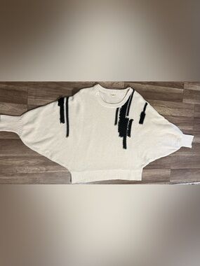 eesome Crewneck Sweater with Black Graphic Accents & butterfly sleeves